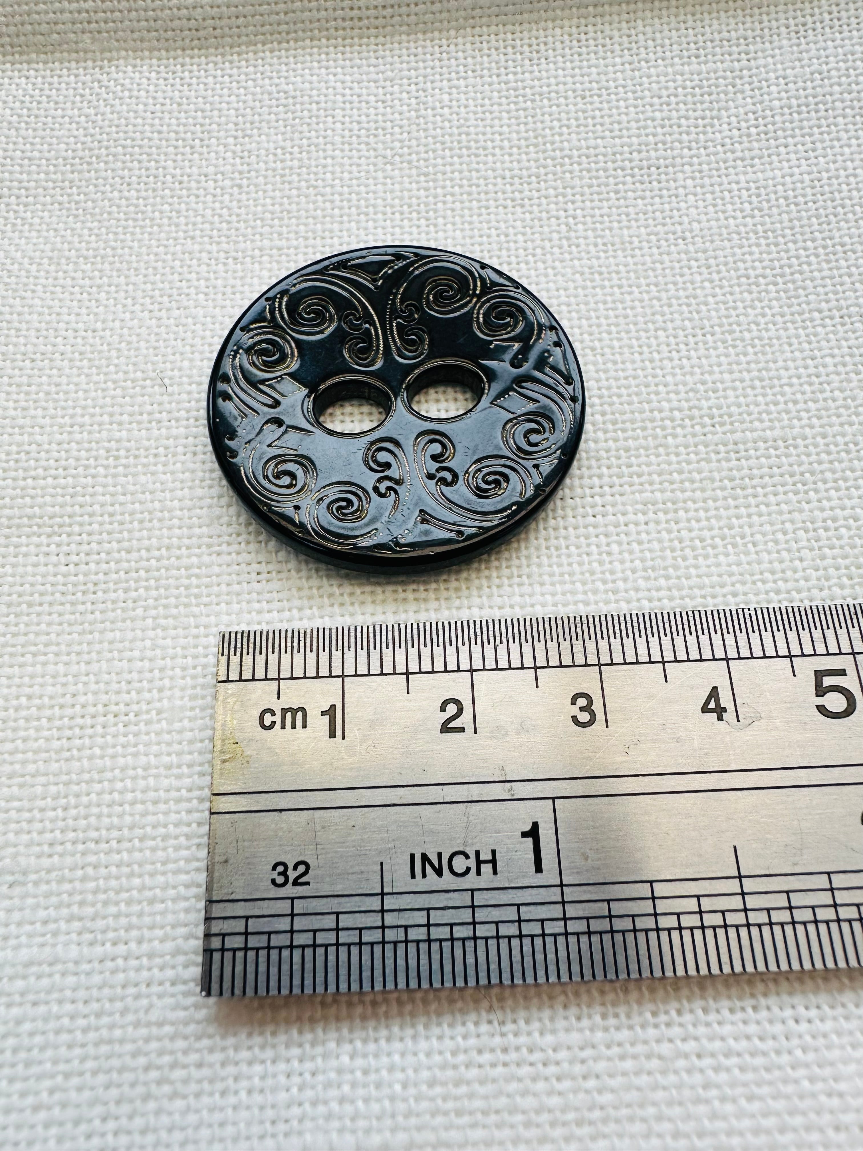 Black Engraved Button with Gold Effect Detail – 34mm